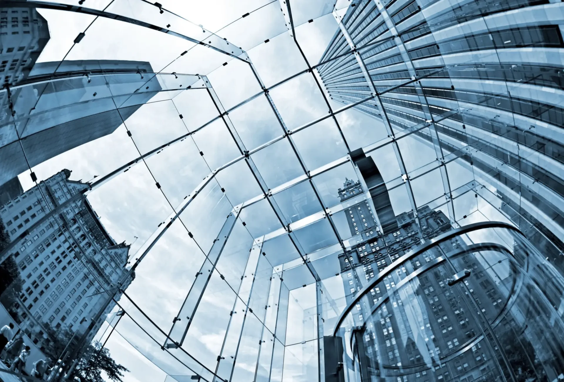 Modern glass architecture with city skyline