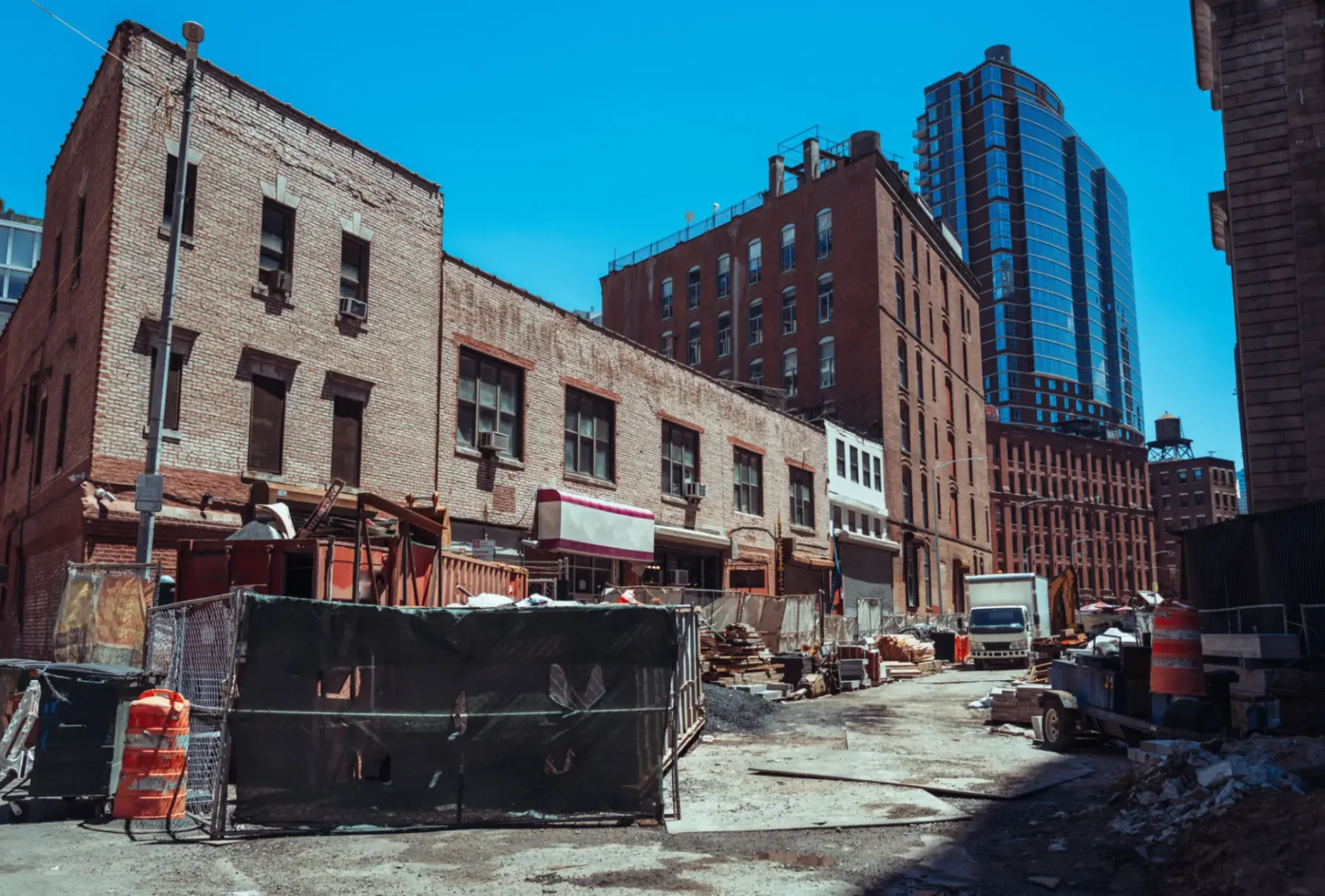 Urban street with old buildings and skyscraper