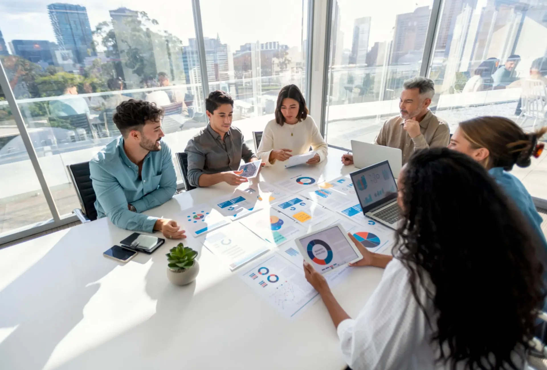 Team discussing charts in a meeting room